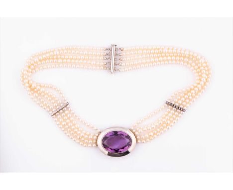 A silver, pearl, and amethyst necklacethe oval silver pendant inset with a large oval-cut amethyst, pendant approximately 3.8
