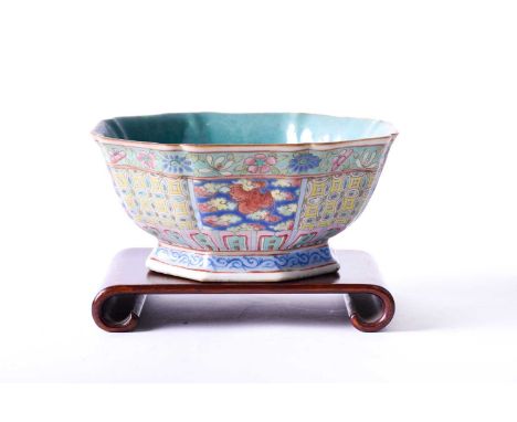 A Chinese porcelain octagonal bowl, late 19th century, with turquoise ground interior, the exterior decorated with panels of 