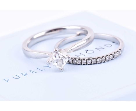 A platinum and diamond ring, set with a square modified brilliant-cut diamond of 0.52 carats, colour and clarity E, VVS2, siz