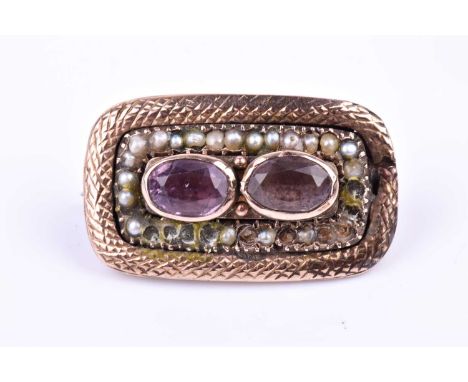 A 19th century gilt, amethyst, and pearl brooch, of rectangular form, centred with two mixed oval-cut amethysts, within a bor