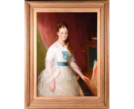 19th century English School, a portrait of a young woman, in a white lace dress with blue ribbons, standing beside a piano, m