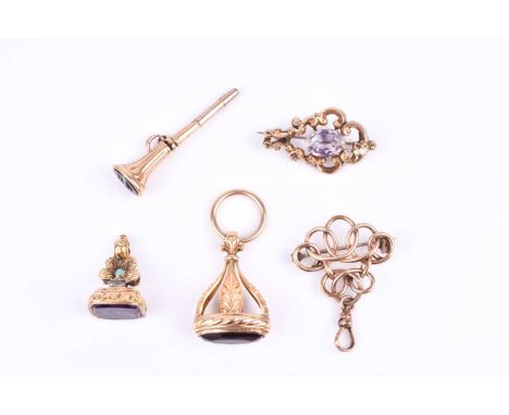 A yellow metal and amethyst fob seal pendant, of floral design inset with turquoise, unmarked, 2.2 cm long, together with a y