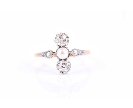 An old-cut diamond and pearl ring, set north to south with a pearl between two old-cut diamonds, the diamonds of approximatel