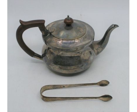 A George V silver teapot with wooden handle and finial, Chester 1911, makers mark indistinct, together with a pair of George 