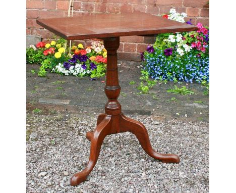 An Edwardian tilt topped mahogany tripod table, the rectangular top supported on a turned column, raised on cabriole legs 69c