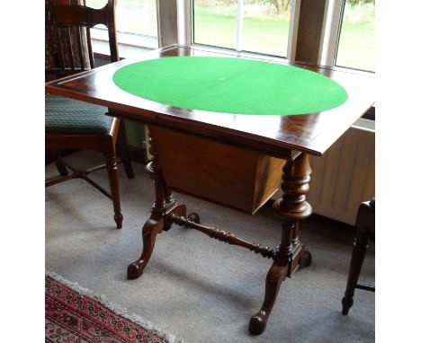 An early to mid Victorian rosewood fold-over card table, green baized top, raised on turned supports, standing on cabriole le