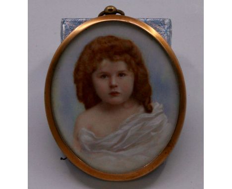 An early 20th century portrait miniature of a young girl with lightly draped shoulders, 7cm x 5.5cm, in gilt frame