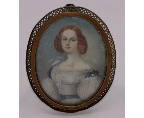 An early 19th century portrait miniature of a lady wearing a cream dress with leg o' mutton sleeves, oval, 8ccm x 6cm