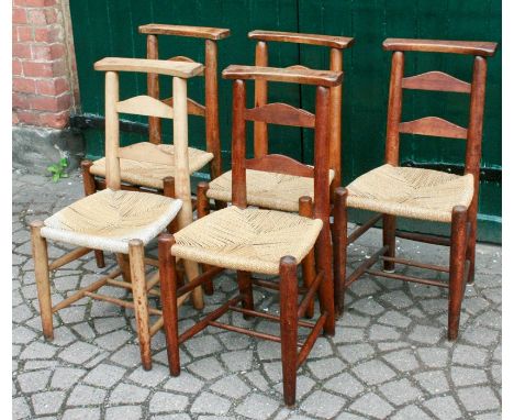 Five mid 20th century rush-seated stained oak chairs (one a lighter colour) ladder backs, rush woven bow fronted seats, circu