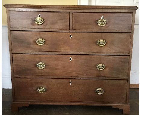 A George III mahogany chest of drawers, moulded top over two short and three graduated cockbeaded drawers, with diamond shape