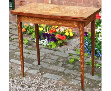 A 19th Century Dutch mahogany and satinwood foliate marquetry fold over card table, in rectangular shape with a draw-legged s