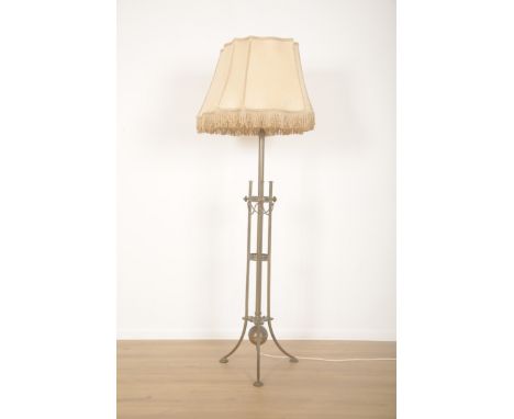 A BRASS EDWARDIAN STANDARD LAMP OF REGENCY STYLEearly 20th century, the central column with two pierced circular galleries of