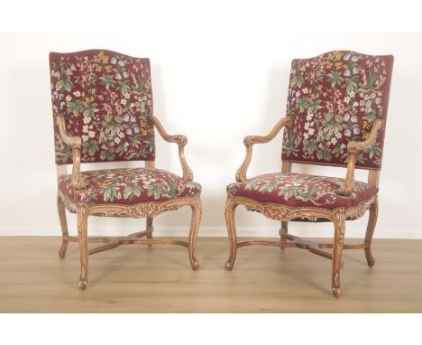 A PAIR OF FRENCH OPEN ARMCHAIRS OR FAUTEILS IN LOUIS XV STYLE20th century or later, walnut with down swept arms carved with s