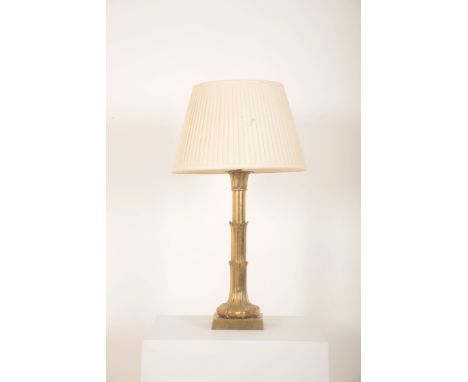 A BRASS FLUTED 'PALM TREE' COLUMN LAMP 20th century, 70cm high, including pleated ivory shade (2) Provenance: The Egerton Pla