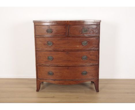 A GEORGE III MAHOGANY AND CROSSBANDED BOWFRONT CHEST OF DRAWERSwith two short and three long graduated drawers, on tall brack