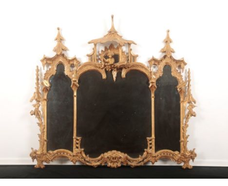 A GILTWOOD MIRROR OF CHINESE CHIPPENDALE DESIGN OF GEORGE III STYLE 20th century, the three shaped plates within a foliate an