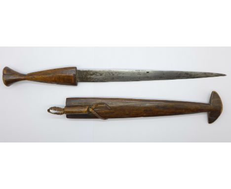An African dagger with carved wooden handle and scabbard, 39cm with scabbard 