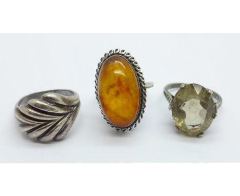 A Russian silver and amber ring, size N, and two other silver rings, (size M, shank a/f and stone set size O) 
