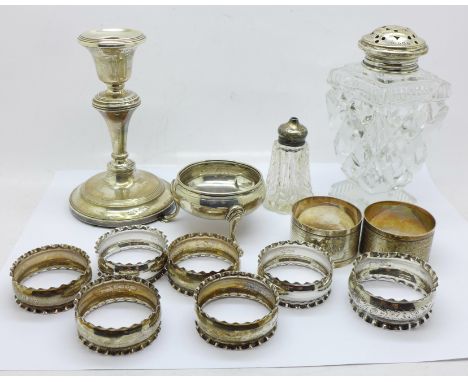 A Georgian silver salt, a set of six silver napkin rings, three other silver napkin rings, a silver candlestick, a silver top