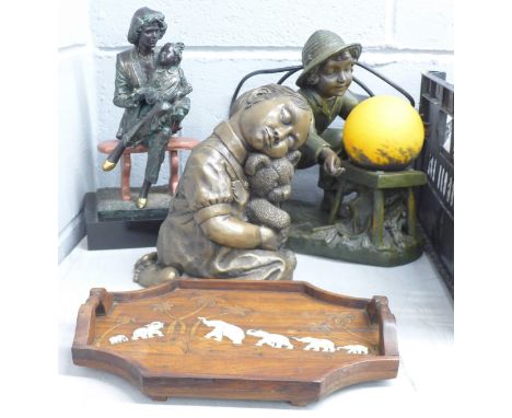 A figural table lamp, two other figures and a tray decorated with elephants **PLEASE NOTE THIS LOT IS NOT ELIGIBLE FOR POSTIN