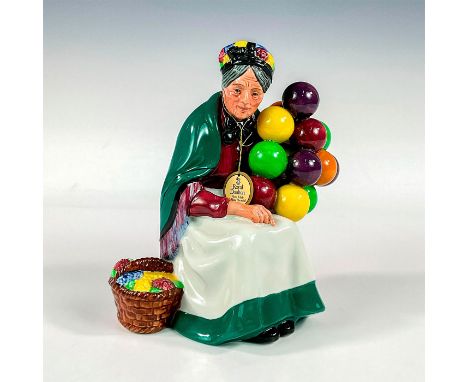 Limited edition ceramic tableware from "The Seller" series. A merchant sits alongside a basket of flowers and an assortment o