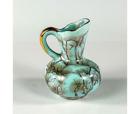 Turquoise toned with lustre finish &amp; branch patterning. With handle.Golden Jumbo Gouda sticker on front exterior. This it