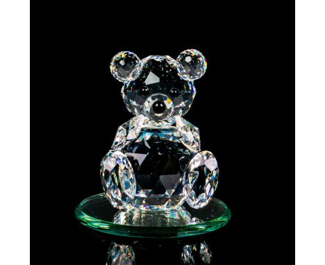 Lead crystal figure part of the Woodland Friends. Modeled as a seated bear with arms up and sits on a round mirror base. Swar