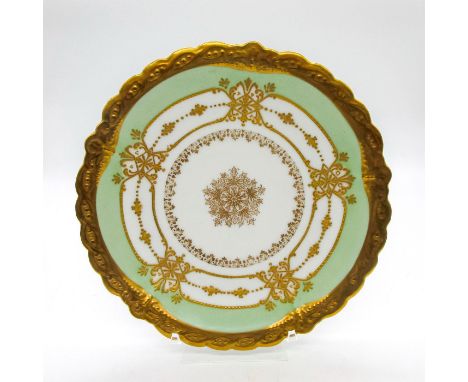 Decorated in elegant golden pattern with gold gilt rim. B&amp;H Limoges backstamp.This item has no reserve. Dimensions: 8.75"