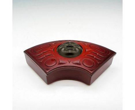 Storey box is made of recycled glass in fan shape with bronze moon face in center. BOMA sticker. Artist: Michael GarfieldIssu