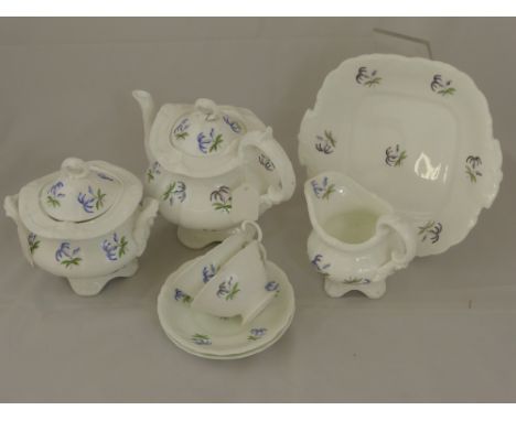 A Part 19th Century Blue Flower Porcelain Tea Set, comprising teapot, sugar bowl, milk jug, ten saucers, eight tea cups, slop