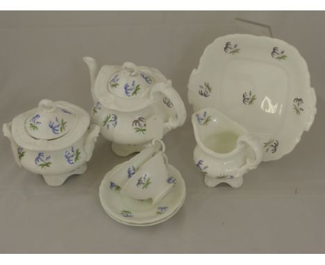 A Part 19th Century Blue Flower Porcelain Tea Set, comprising teapot, sugar bowl, milk jug, ten saucers, eight tea cups, slop