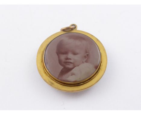 An Edwardian Enamel and Gilt Mourning Locket and Part Gold Chain.