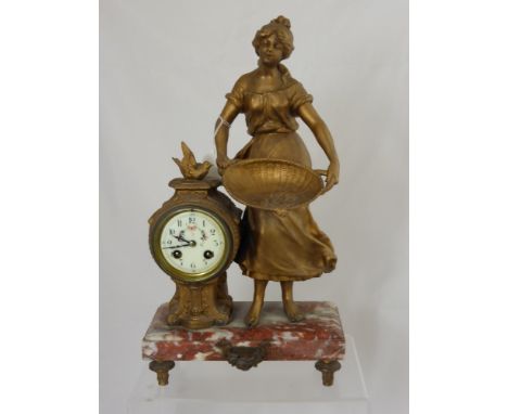 A Victorian marble based mantle clock depicting a farm girl, the clock having a painted porcelain face.