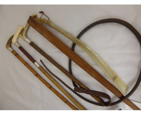 Two Antique Leather and Silver Collared Riding Whips and a silver collared Hunting Whip, with bone or antler handles together