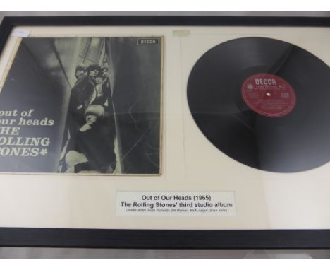 A framed and glazed Rolling Stones album "Out of Our Heads" by Decca records 1965 together with a black and white photograph 