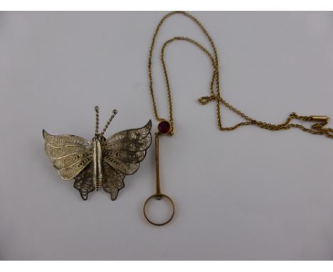 A Maltese style silver butterfly brooch together with a 9 ct gold and pink stone art deco style necklace. (2)