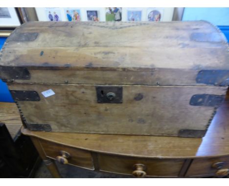 A vintage pine box having a domed lid, makers Joseph H Corin, Cardiff, box and trunk makers, approx. 66 x 39 x 59 cms.