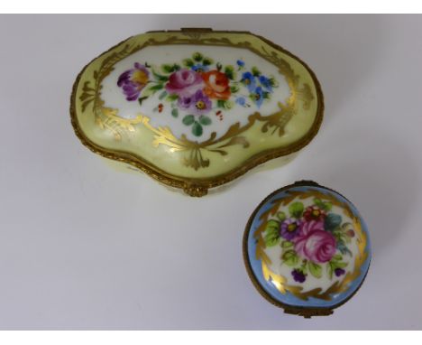 Two Antique Hand Painted Limoges Boxes, the first a circular blue pill box hand painted with pink rose spray, the second a le