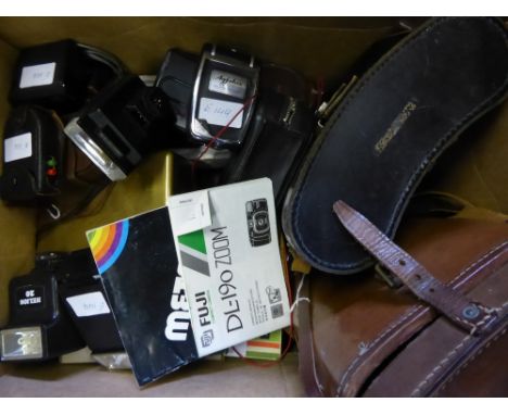 An Olympus OM-1 Camera together with three separate lenses in camera case, a Leika Ernst Leitz Wetzlar, Germany, with Leitz E