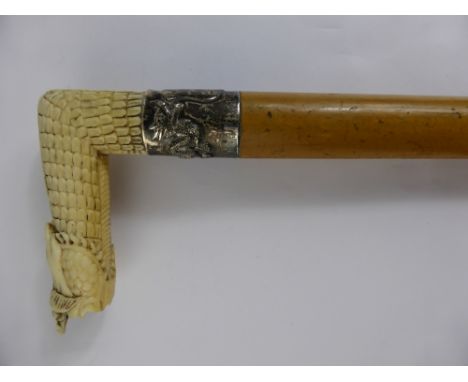 An Antique Silver Banded Chinese Walking Stick with ivory handle (WAF). 