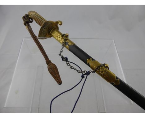 An Imperial Japanese Officer's Sword. The sword having a brass floral decorated guard with flip down lock and having Japanese