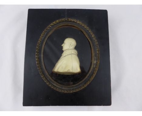 An 18th Signed Wax Carving of an Italian Priest. The robed figure signed L. Hagloll to base in original oval portrait frame w