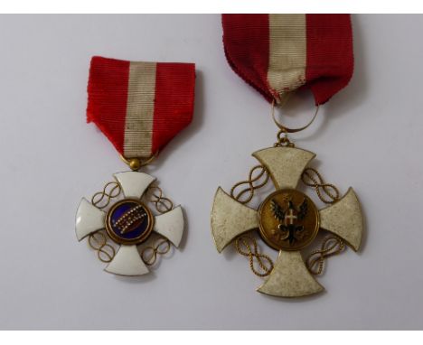 An Order of the Crown of Italy, Commander, a large gold edge white enamel cross with a loop for ribbon suspension, the revers