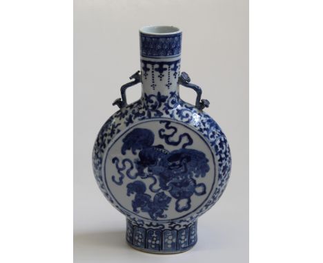 A 19th century Chinese blue and white moon flask of typical form, decorated underglaze with playful kylin reserves on a geome
