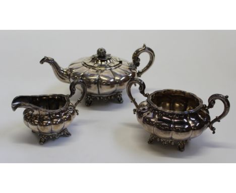 A Victorian Dublin sterling silver pumpkin form tea set. Comprising a Pumpkin form teapot, with pumpkin shaped knop, two hand