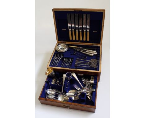 An Edwardian oak cutlery canteen, largely containing part sets of EPNS flatware, together with a small quantity of hallmarked