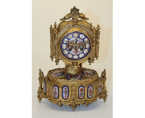 Le Roy et Fils, a 19th century French ormolu mantle clock. The Gothic revival case set with figural and crested porcelain pla