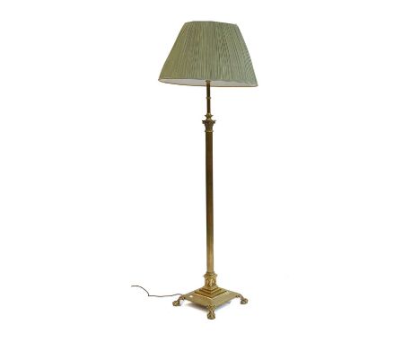 A Brass Corinthian Columnar Standard Lamp, on paw feet, 180cm high (including shade)