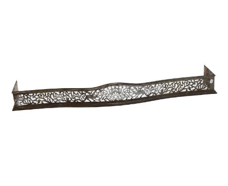 A George III Pierced Steel Fender, decorated with dragons and scrolling foliage, internal measurements 155cm by 32cm