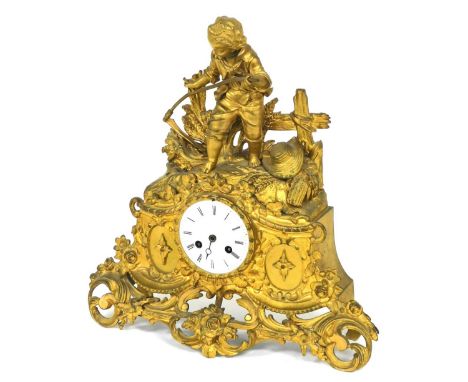 A 19thC French ogilt metal mantel clock, circular enamel dial bearing Roman numerals, eight day movement with bell strike, th